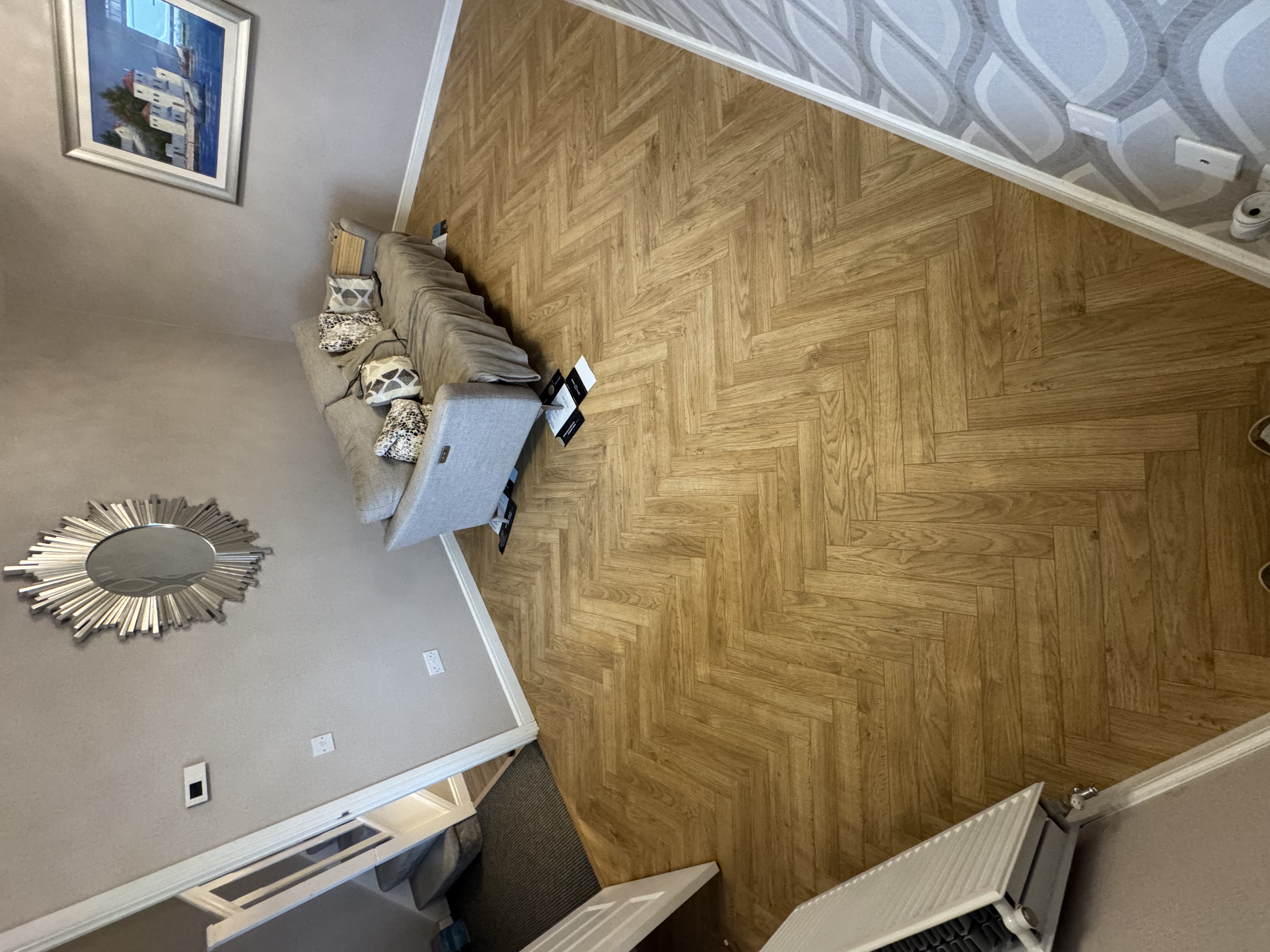 Herringbone flooring in a finished living room