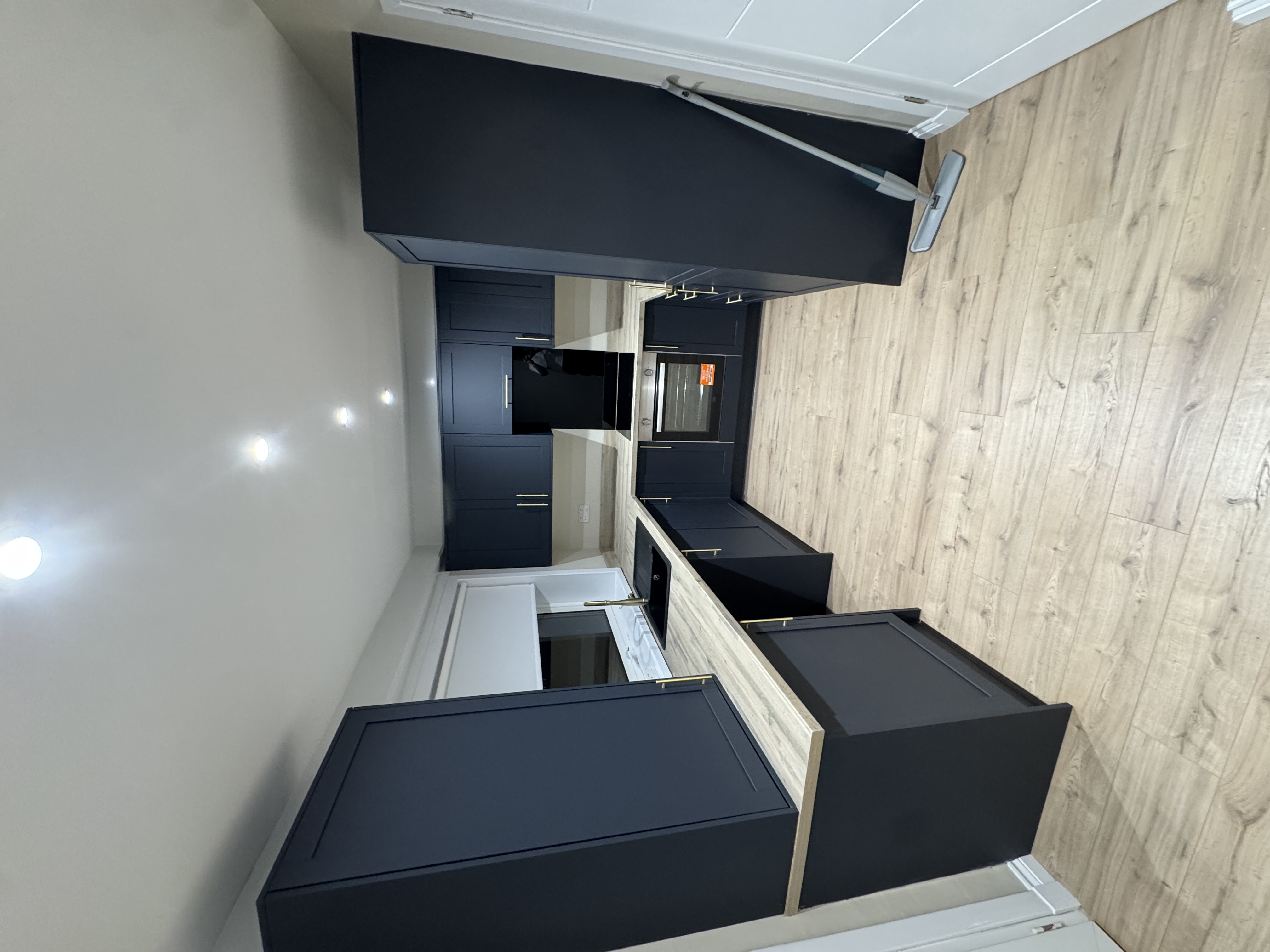 Navy shaker kitchen installation