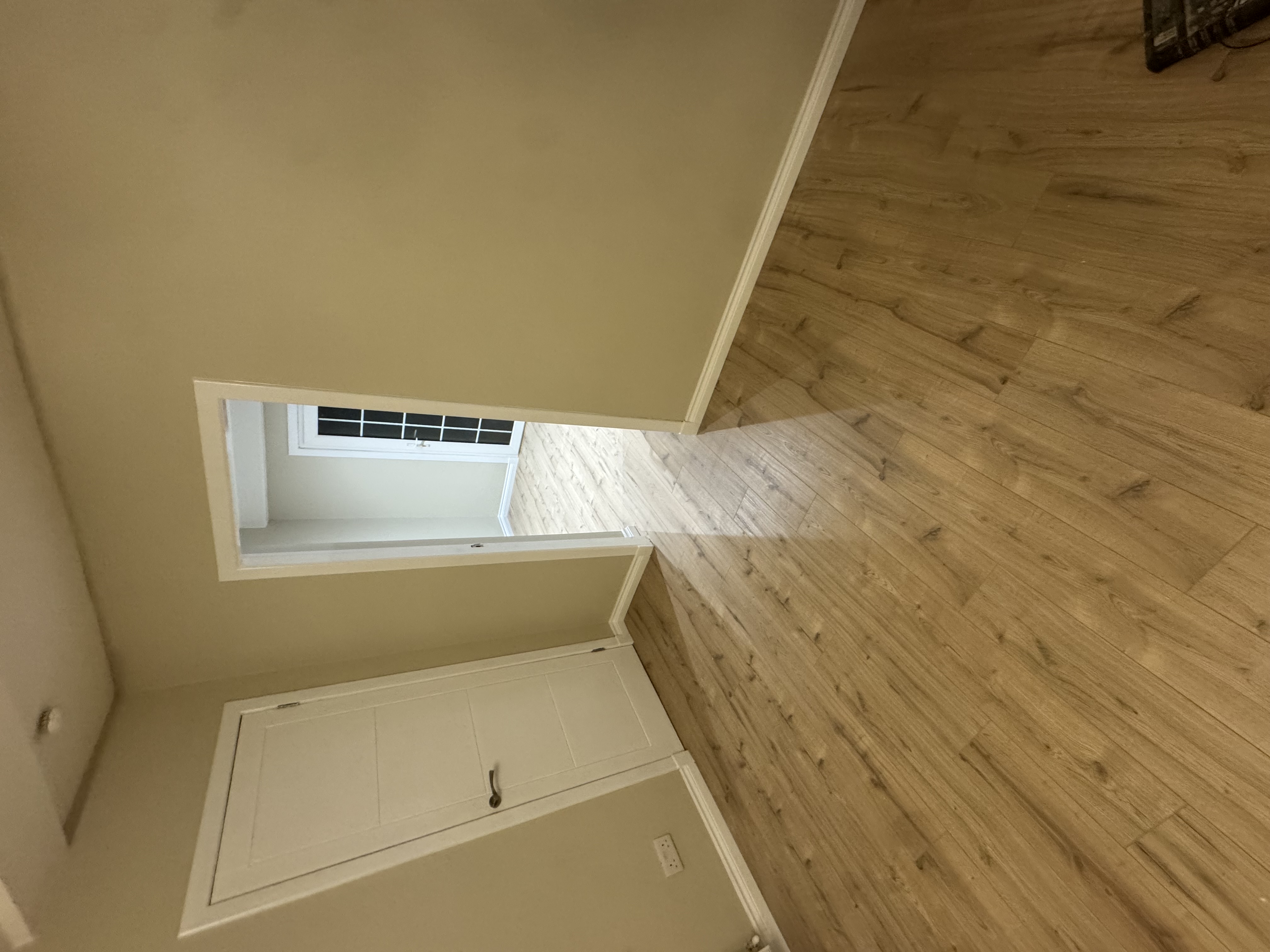 Light oak plank flooring on a landing